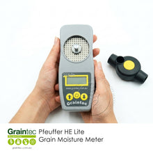 Load image into Gallery viewer, Demonstration of the Pfeuffer HE Lite moisture meter held in hands with the grinding cover removed to show the measurement chamber.