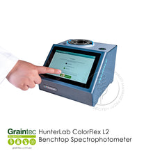 Load image into Gallery viewer, User interacting with the touchscreen interface of the HunterLab ColorFlex L2 benchtop spectrophotometer | Graintec Scientific
